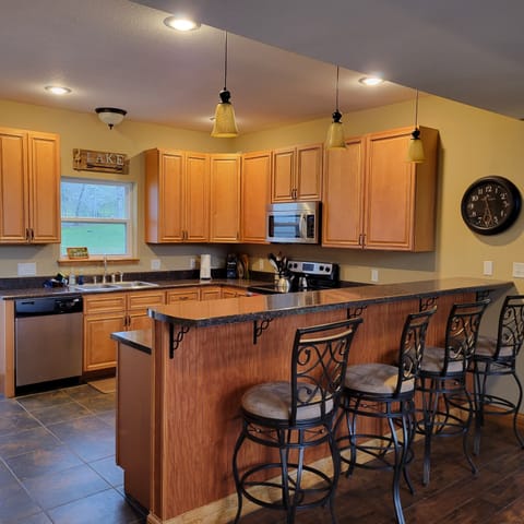 Kitchen with counter with seating for 4