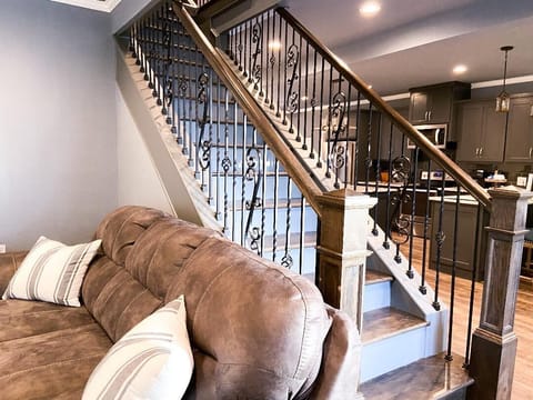Stairs that lead to other bedrooms and a bathroom.