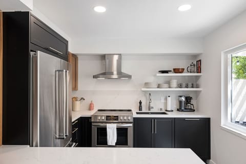 Brand new chef kitchen with walnut cabinets, premium stainless steel appliances