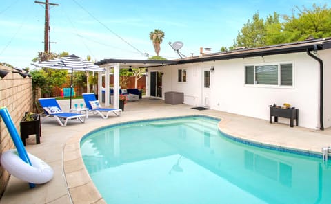 Private pool with umbrella, beach chairs and pool toys