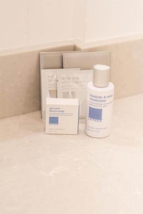 Shower, hydromassage showerhead, designer toiletries, hair dryer