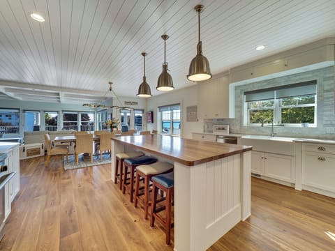 Sunlit kitchen with two-sided farmhouse sink