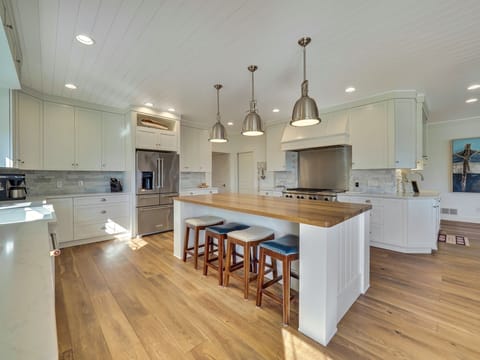 A chef's kitchen with large island (seats 8), double oven & spacious fridge