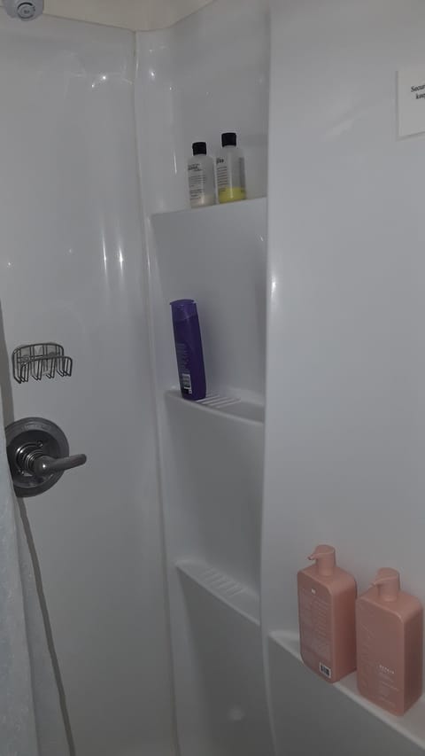 Shower with shampoo and bath soap.