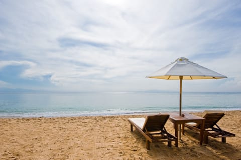 Beach nearby, white sand, beach umbrellas, beach towels