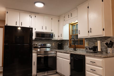Fully equipped kitchen with granite counter tops & upgraded fixtures.