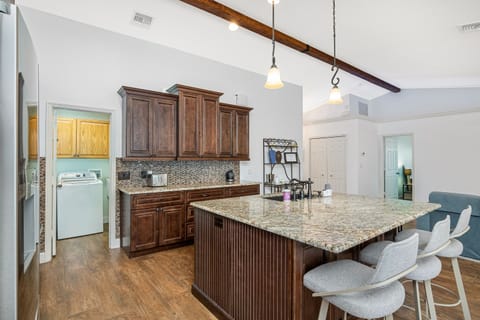 View of the kitchen, with the laundry room to the left