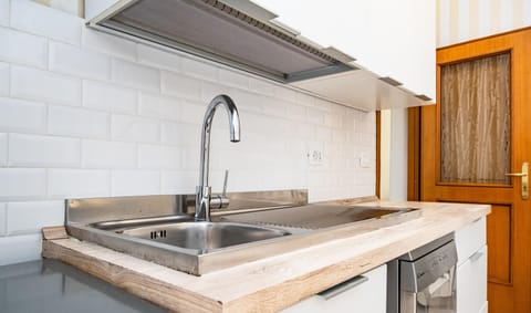 Fridge, electric kettle, toaster, cookware/dishes/utensils