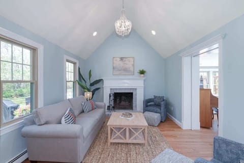 Unwind in this charming living room, styled for comfort and connection. While the fireplace is decorative, the space still offers that warm, welcoming vibe that makes you want to curl up and stay awhile.