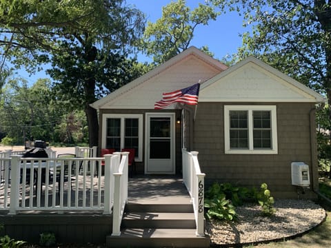 Front exterior featuring a new, large deck.