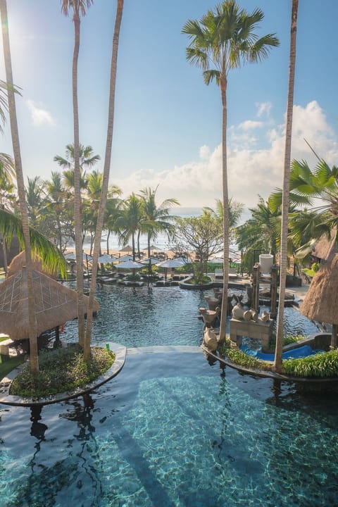 4 outdoor pools, open 8:00 AM to 8:00 PM, pool umbrellas, sun loungers