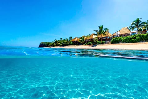On the beach, white sand, sun loungers, beach umbrellas