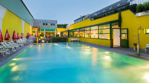 Seasonal outdoor pool, open 8 AM to 10 PM, pool umbrellas, sun loungers