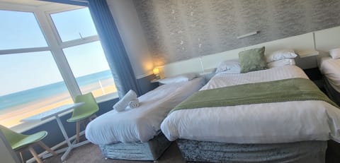Family Room, Sea View (2 adults + 2 children) | Iron/ironing board, free WiFi, bed sheets