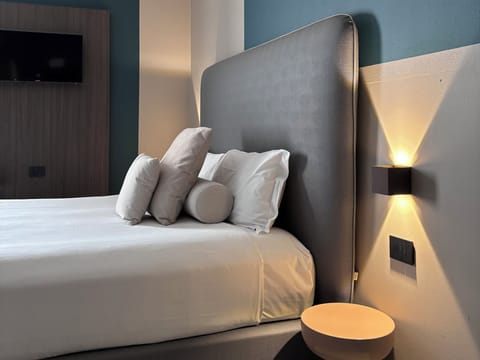 Family Room | Premium bedding, down comforters, in-room safe, desk