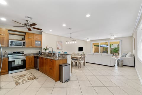 View of open  kitchen, dining and living