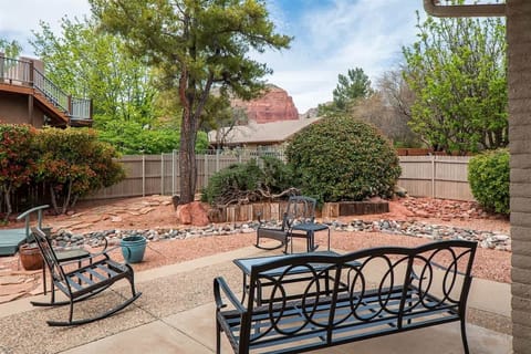 The beautifully landscaped yard features a pond