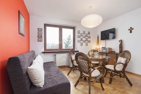 Relax in the stylish living room with a comfortable sofa and traditional decor.