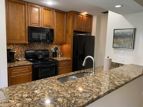 Updated kitchen with beautiful countertops