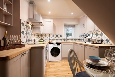 Bughtrig Cottage - a well-equipped Shaker-style kitchen providing all the essentials for a self-catered holiday