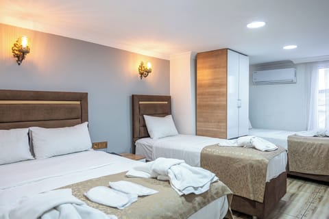 Economy Quadruple Room, 1 Bedroom | Premium bedding, down comforters, soundproofing, free WiFi