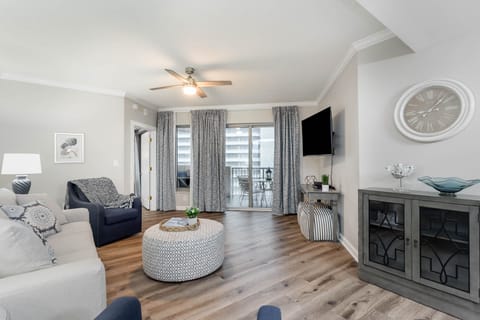 Living room - Beautifully beachy living area with access to the balcony!