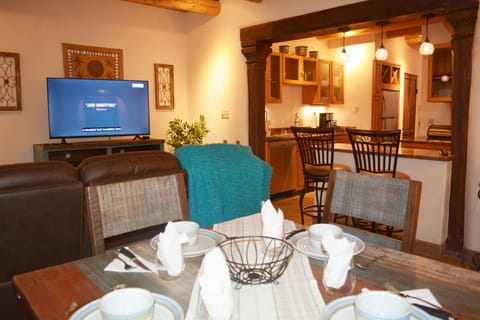 View from dining area to living room and kitchen