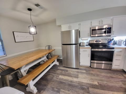 Kitchen with another table and benches.