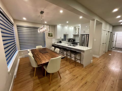 View from living room into Dining room and open concept kitchen