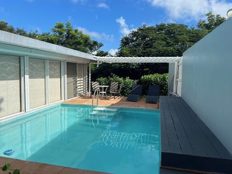 Beautiful remodeled pool with glass tile and graduated steps for easy access.