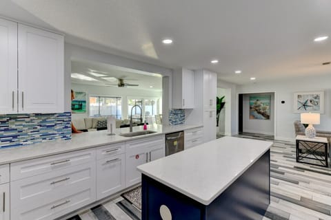 Open concept kitchen with smart refrigerator.