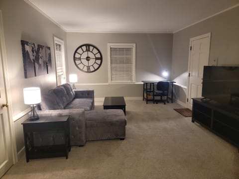 Living Room w/sectional sleeper, desk, two closets, chair and Roku TV