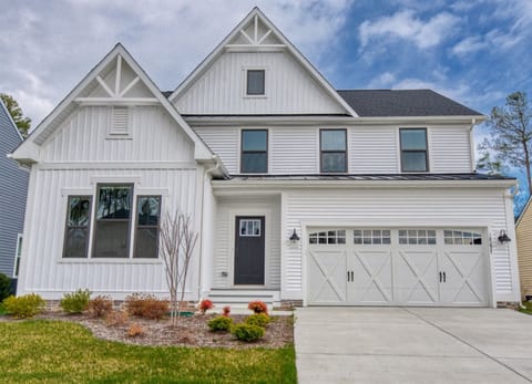 spacious three-story, five-bedroom, five full bathroom large single family home