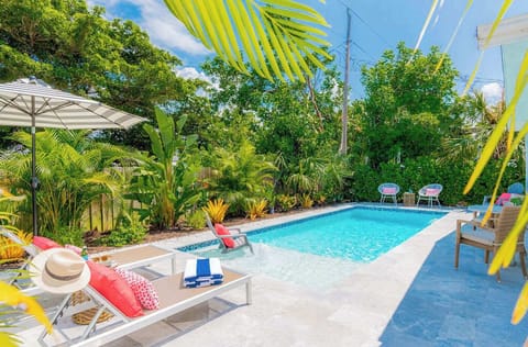 Enjoy the heated pool surrounded by lush tropical lanscaping