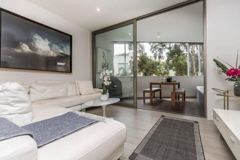 Super comfortable leather lounges, leading out to private sun-filled patio with alfresco dining