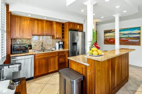 Fully equipped kitchen with granite countertops.