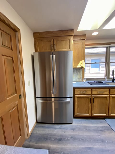 Large new refrigerator (xtra refrigerator, chest freezer,microwave in garage)