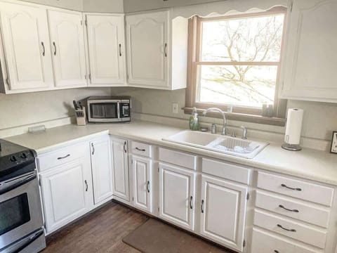 Bright, open kitchen with plenty of space to cook and lots of fridge space! The kitchen should have all of your cooking needs. 
