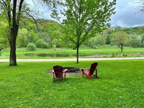 Fire pit with seating and view of the pond across the street