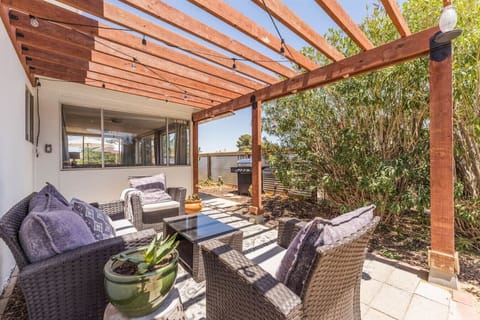 Outdoor lounge area with newly built awning