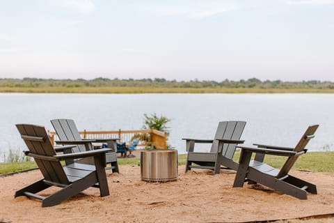 Fire pit and dining area overlooking the lake