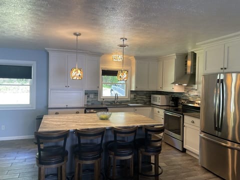 Upstairs/Main living area Kitchen bar/open concept to living room