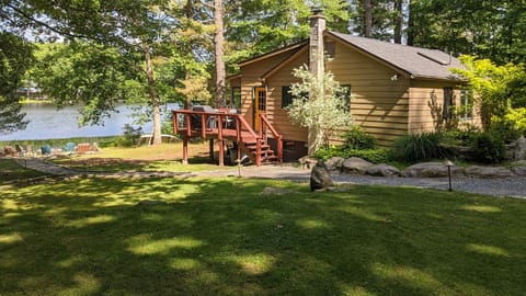 Summer at the cottage means amazing fishing, incredible hiking, firepit cocktails and outdoor BBQs on an expansive lakeside flagstone patio.