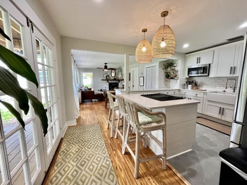 Newly renovated kitchen with quartz countertops and Island.