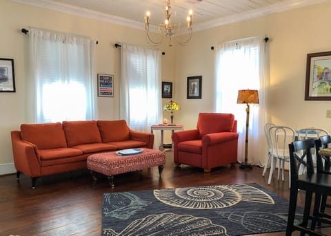 Living room. Plenty of space to relax, with  full 4-person couch and easy chair!