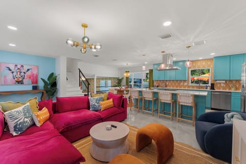 The blue cabinets and pop of orange in the backplash are sure to make you smile