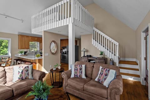 Spacious open-plan living area with comfy seating.