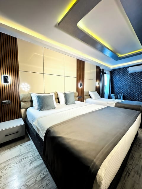 Luxury Triple Room | Premium bedding, minibar, in-room safe, desk