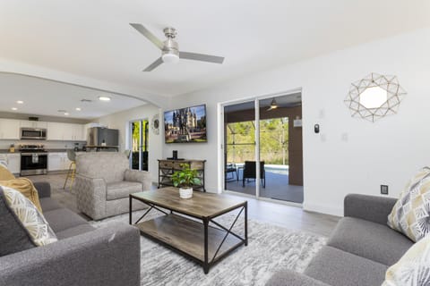 Family Townhome, 5 Bedrooms | Living area | 60-inch Smart TV with cable channels, Netflix, Hulu