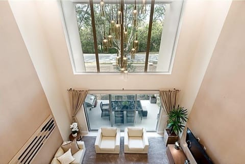 Family Townhome, 4 Bedrooms | Living area | 60-inch Smart TV with cable channels, TV, Netflix